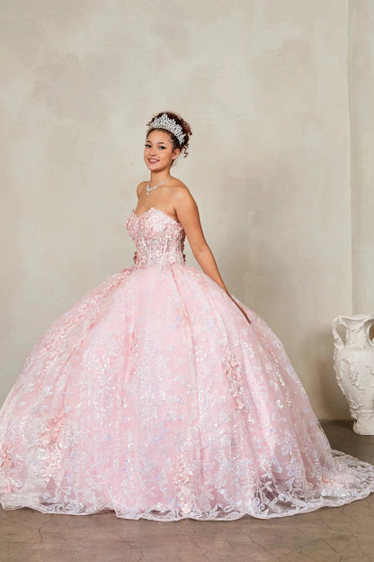 a voluminous blush light pink quinceanera ball gown with floral lace applique