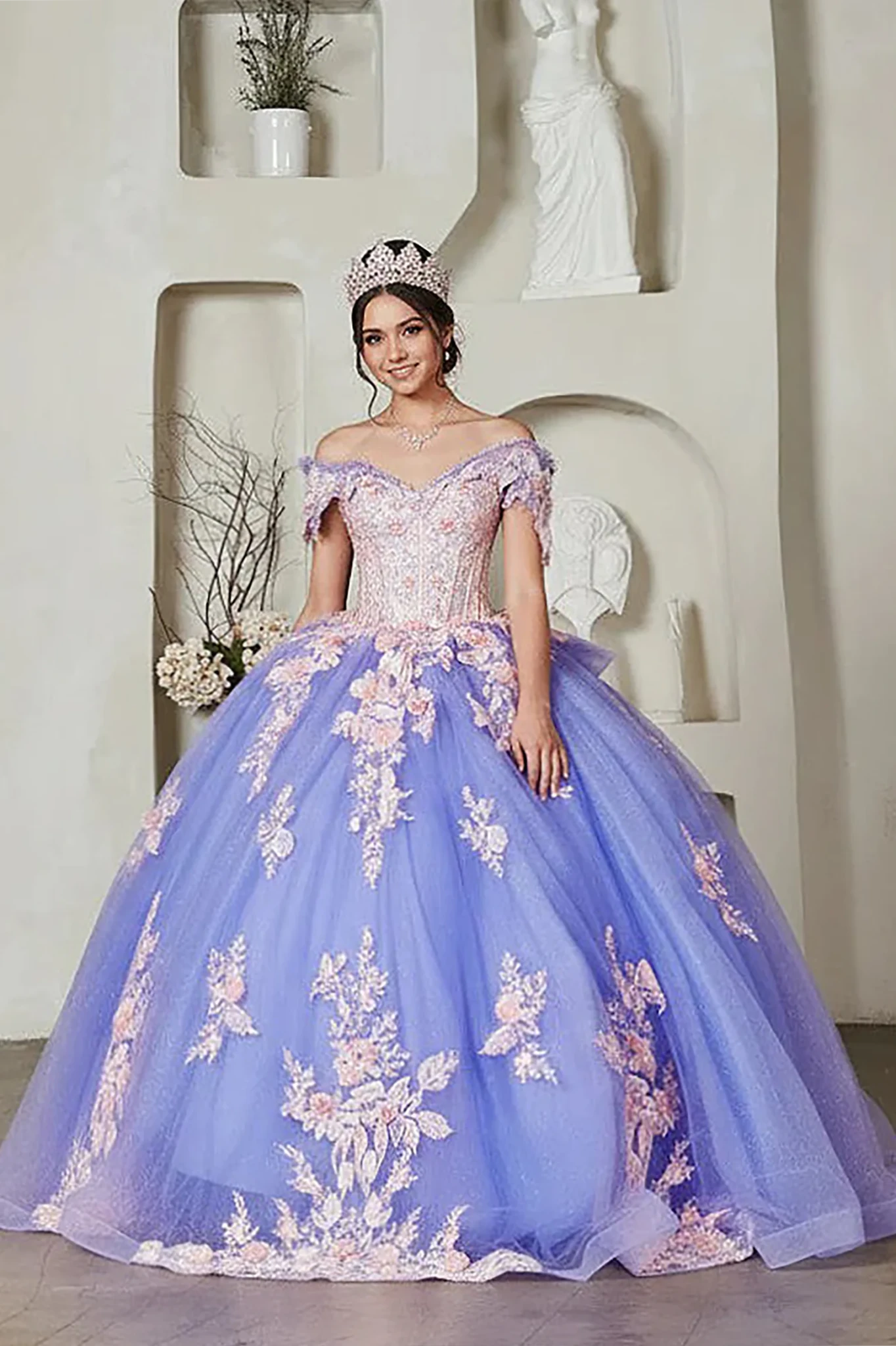 a voluminous off-the-shoulder quinceañera ball gown in lilac and pink appliques