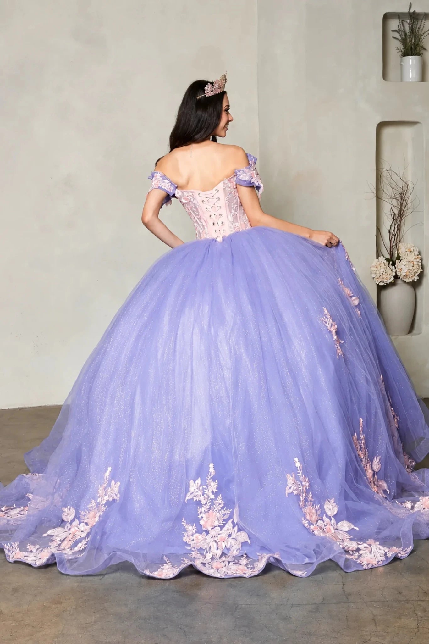 Lilac quinceañera ball gown with blush floral embroidery, crystal beaded bodice and lace‑up back