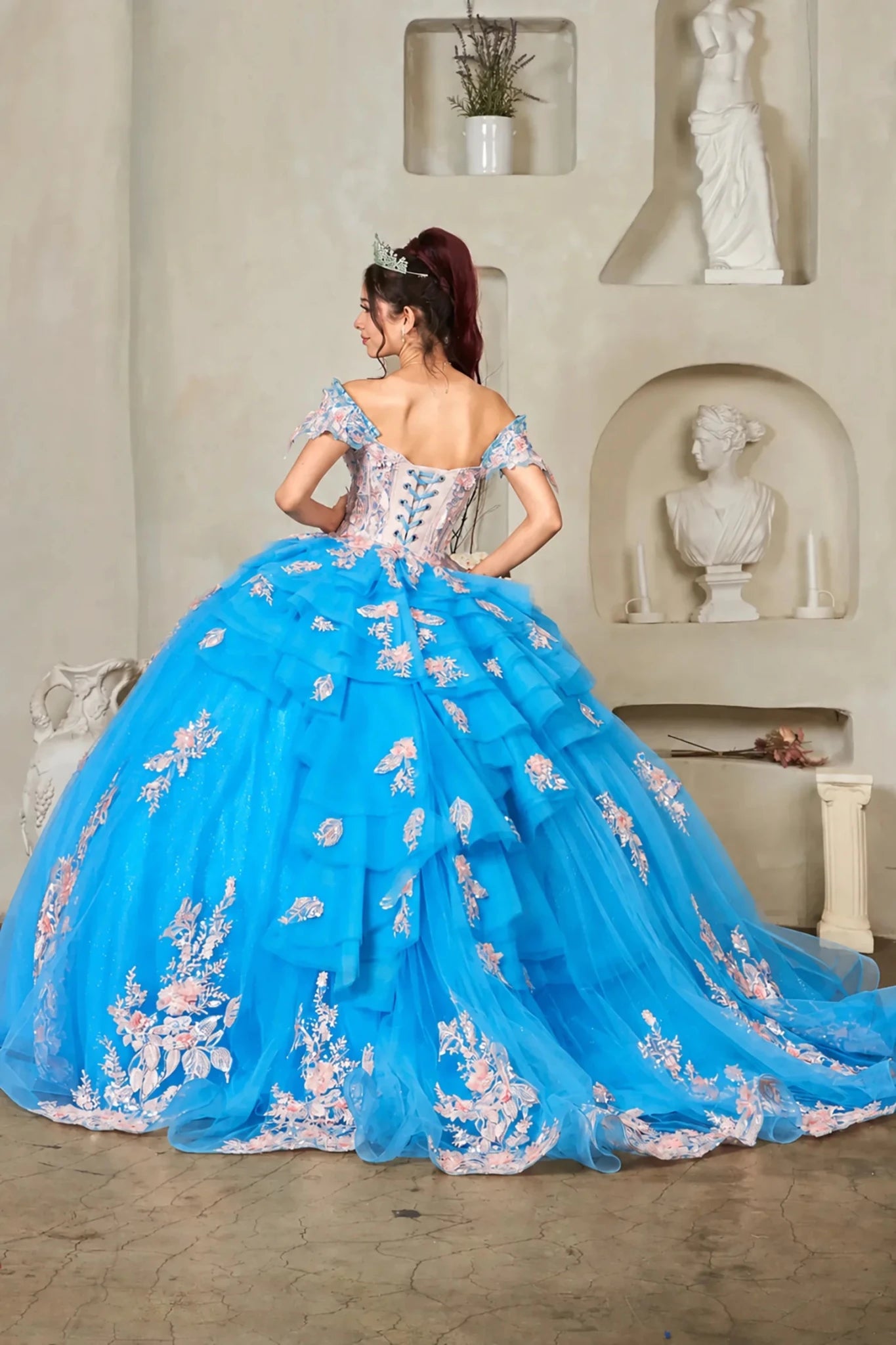 Turquoise quinceañera ball gown with blush 3D floral applique, crystal beaded bodice, layered ruffles and lace‑up back