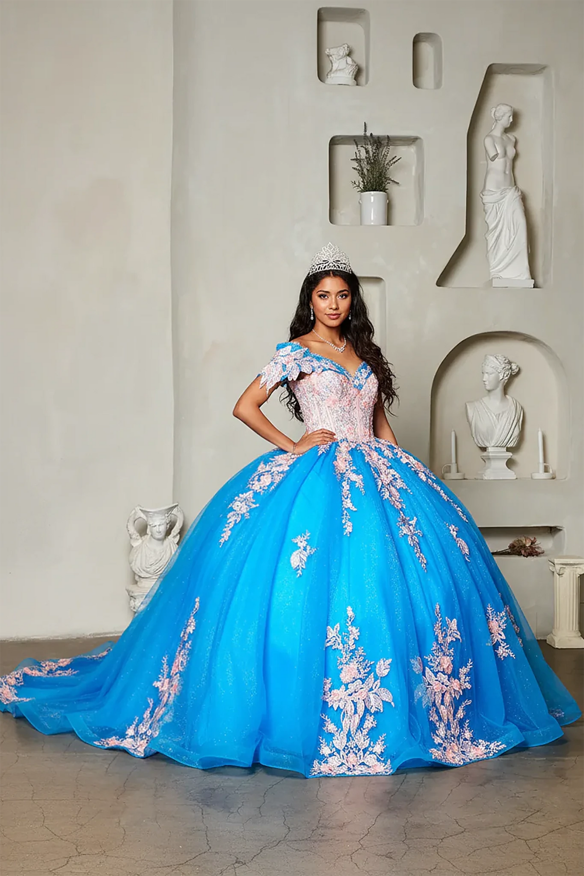 Turquoise quinceañera ball gown with pink floral embroidery and glitter tulle skirt