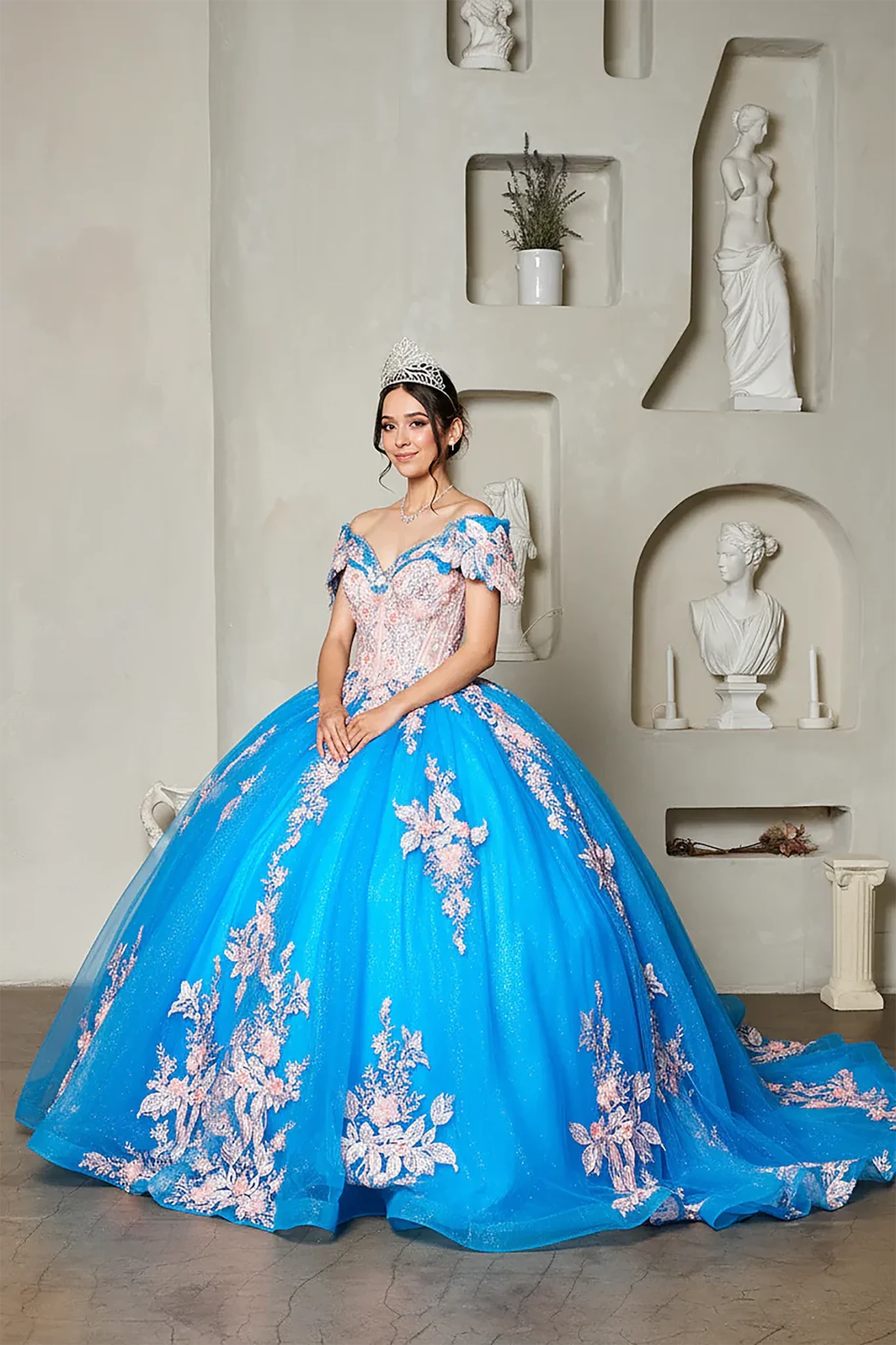 Turquoise quinceañera ball gown with blush floral applique, crystal beaded bodice and long train