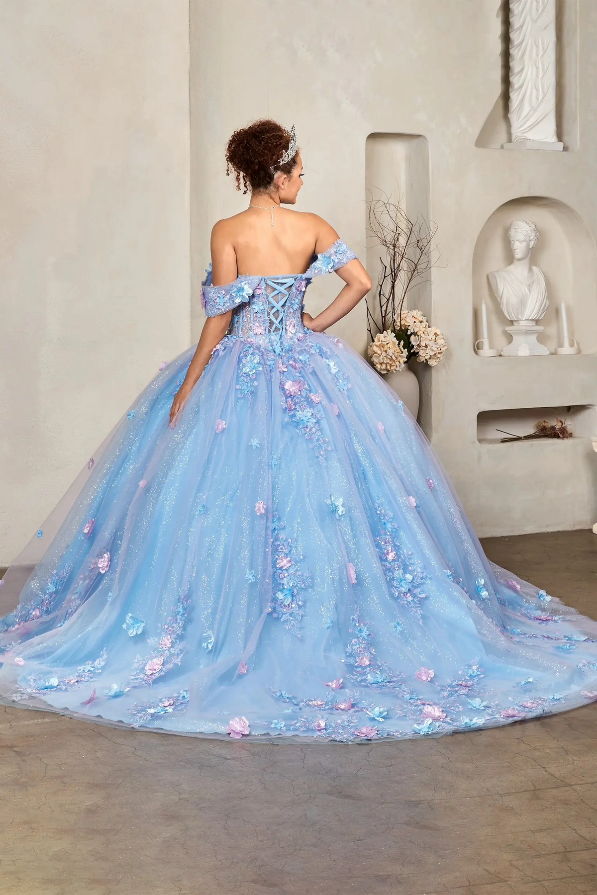 Light blue and lilac two‑tone quinceañera ball gown with off‑shoulder styling, illusion corset and 3D floral applique