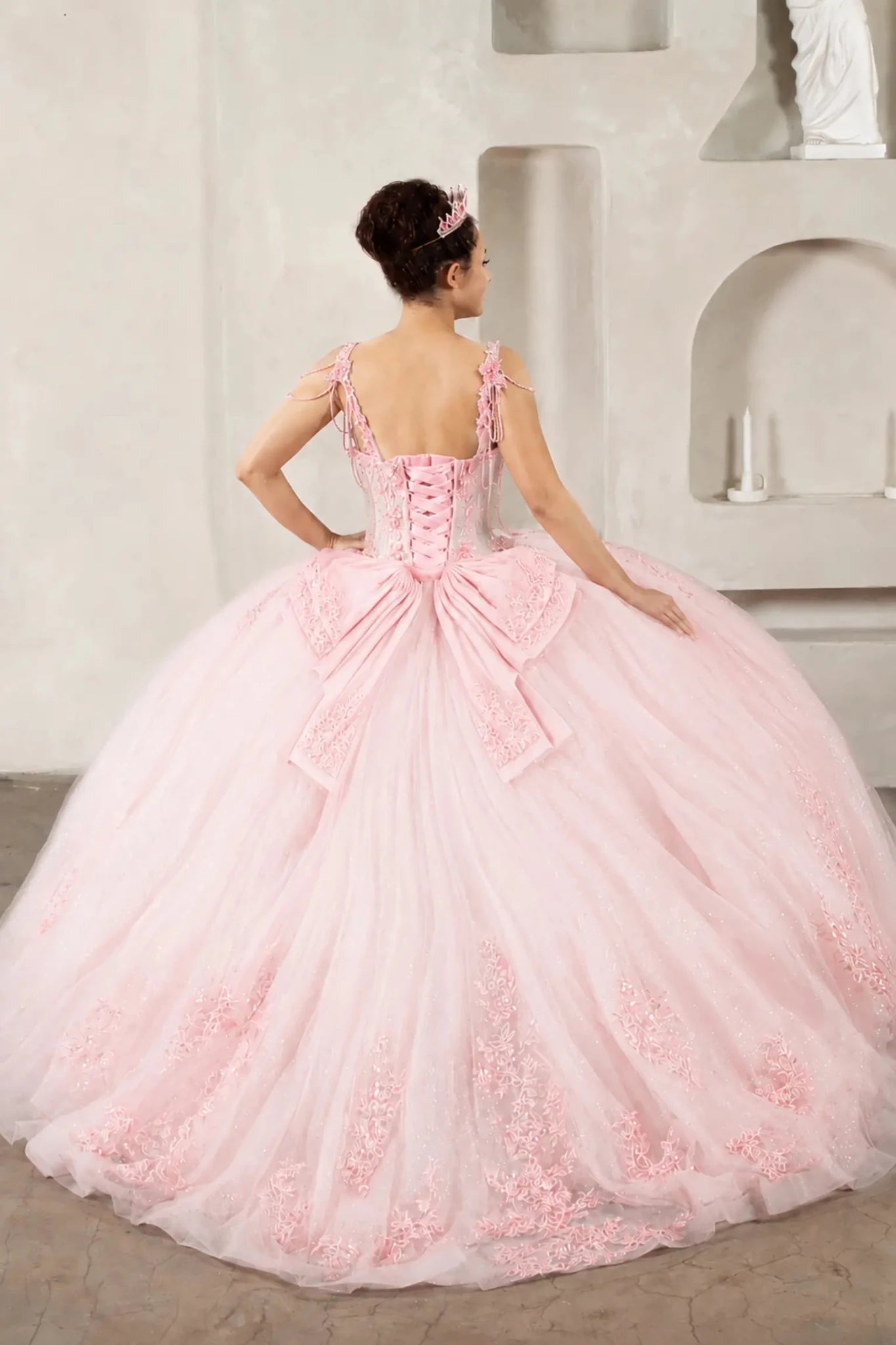 Blush quinceañera ball gown with sheer corset bodice, 3D floral embroidery, detachable bow and sparkle tulle