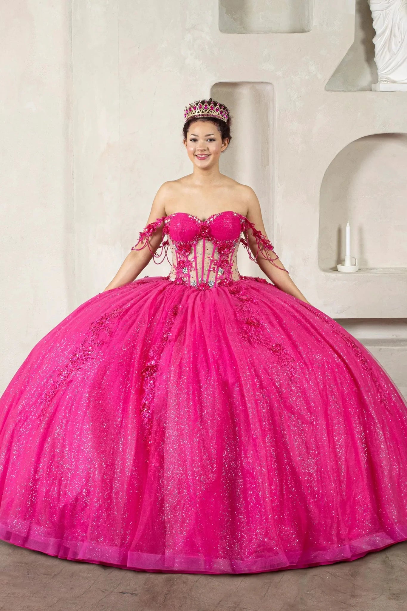Fuchsia quinceañera ball gown with sheer corset bodice, 3D floral embroidery, jeweled off‑shoulder sleeves and detachable bow