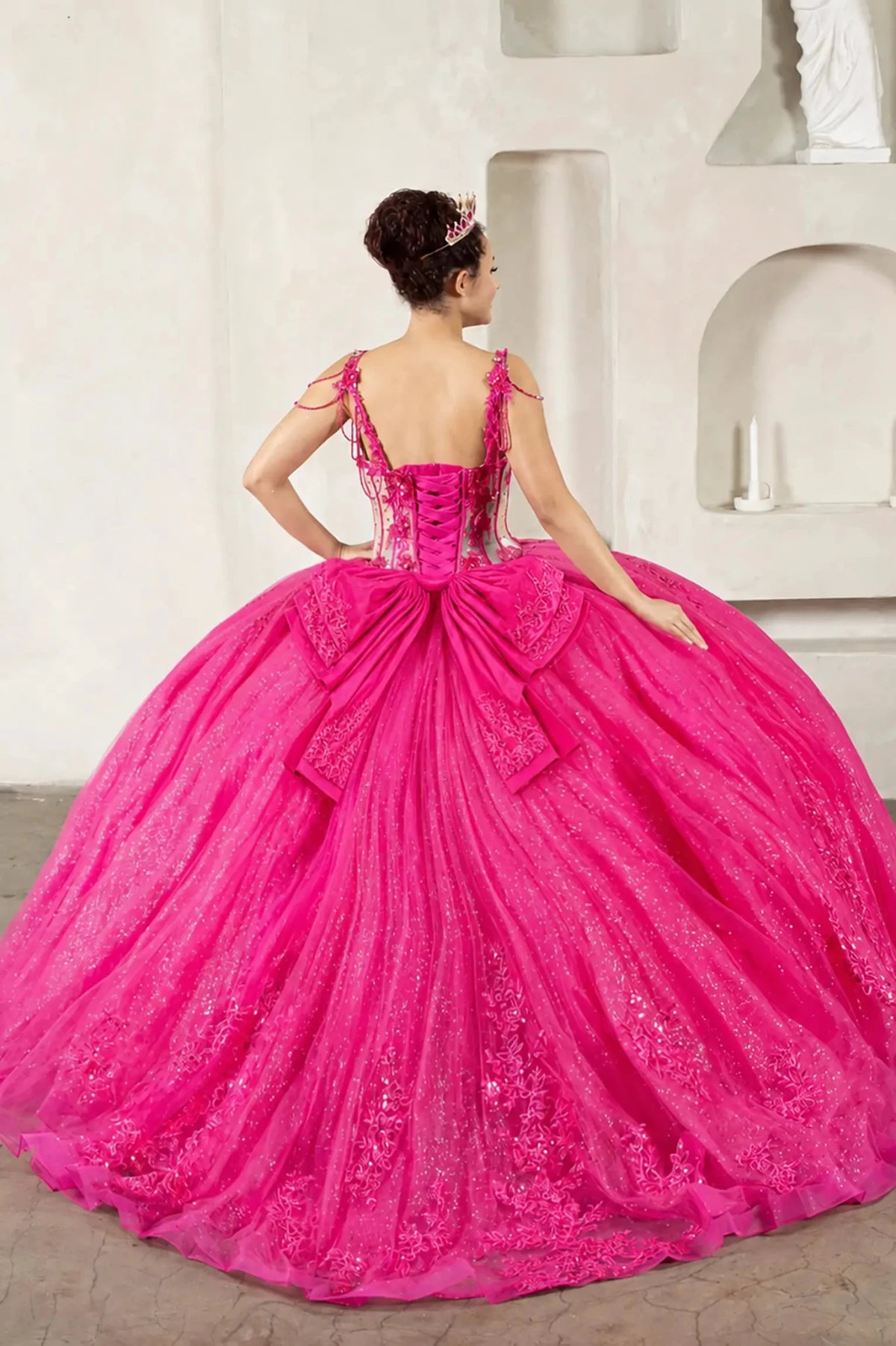 Fuchsia quinceañera ball gown with sheer corset bodice, 3D floral embroidery, detachable bow and sparkle tulle