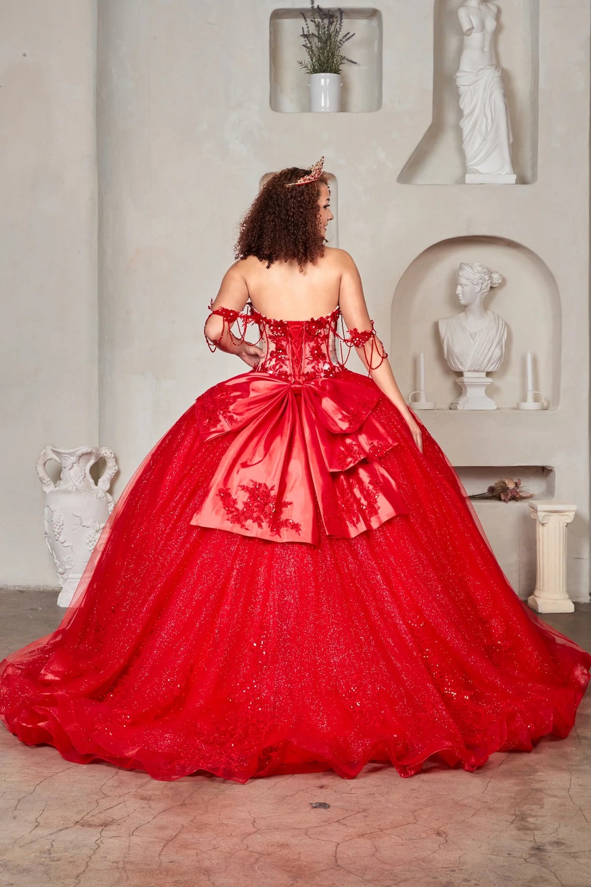 Red quinceañera ball gown with sheer corset bodice, 3D floral embroidery, detachable bow and sparkle tulle