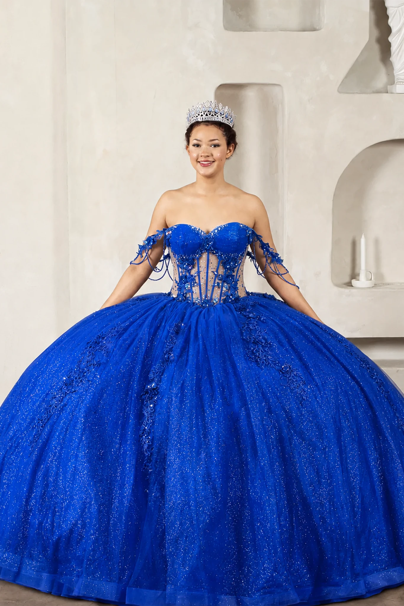 Royal blue quinceañera ball gown with jeweled off‑shoulder sleeves, 3D floral embroidery, detachable bow and sparkle tulle