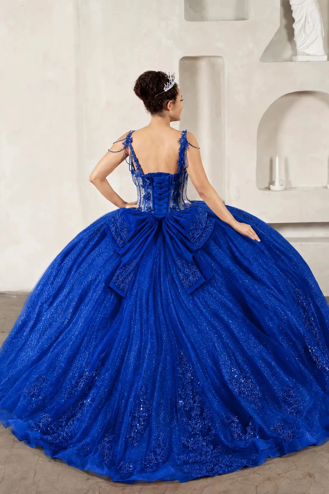 Royal blue quinceañera ball gown with sheer corset bodice, 3D floral embroidery, detachable bow and long train