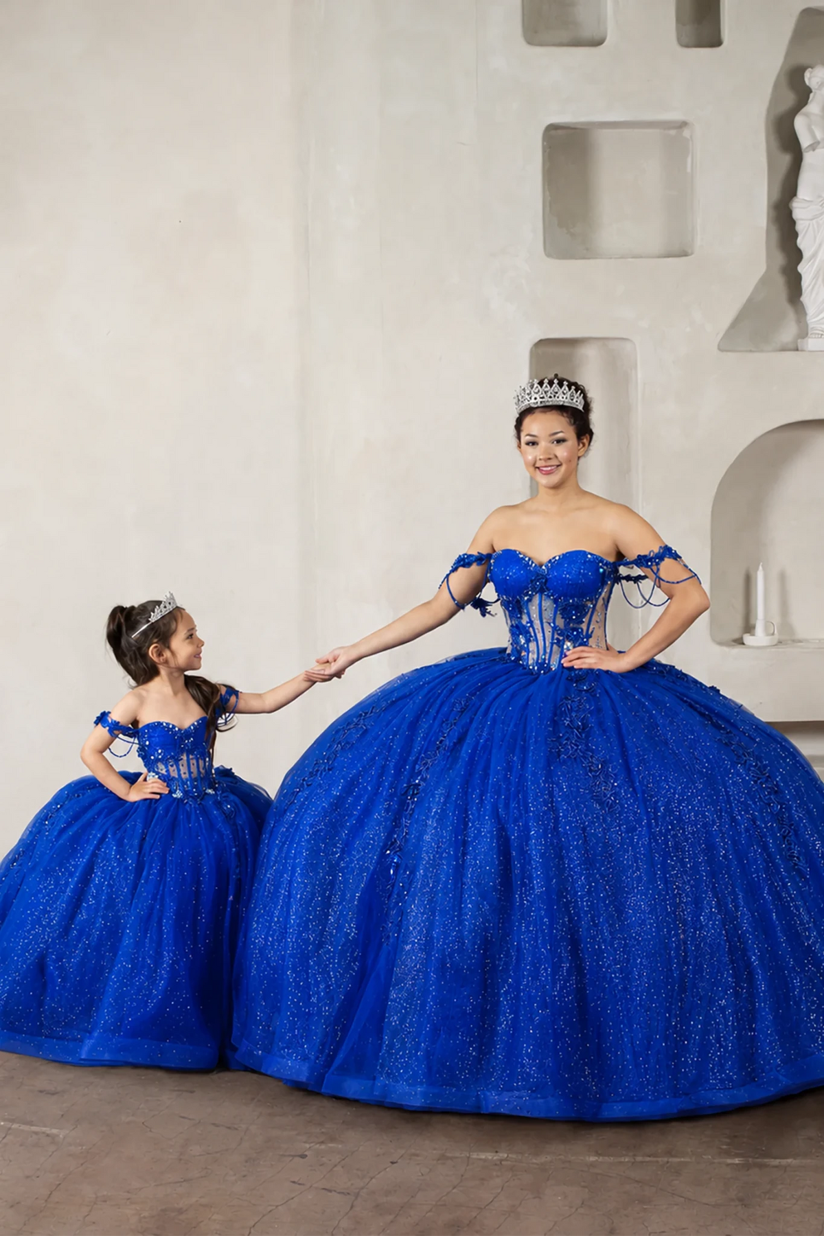 Royal blue quinceañera ball gown with sheer corset bodice, 3D floral embroidery, detachable bow and sparkle tulle