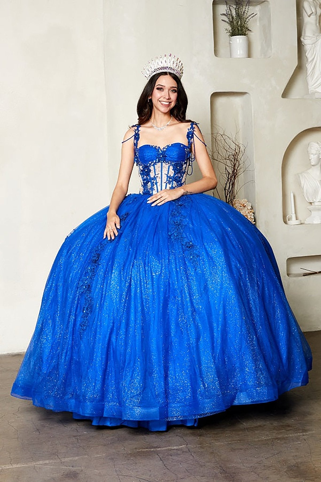 Royal blue quinceañera ball gown with sheer corset bodice, 3D floral embroidery, detachable bow and sparkle tulle