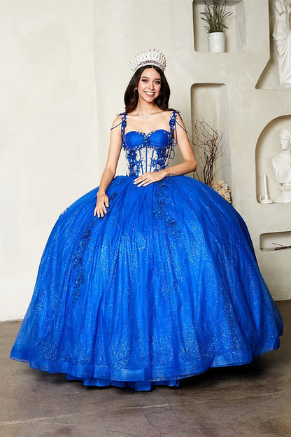 Intricate features stand out across royal blue quinceañera ball gown with sheer corset bodice, 3D floral embroidery, detachable bow.