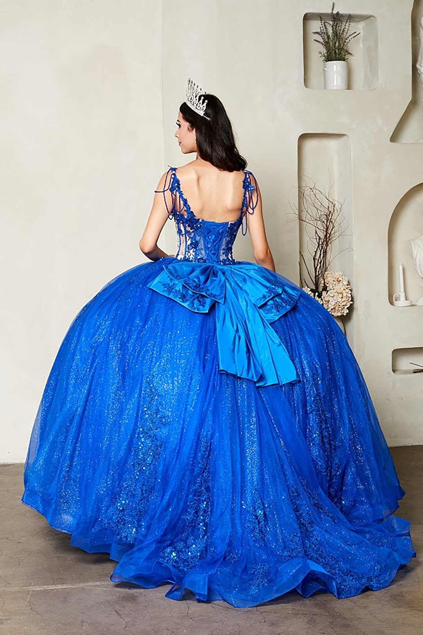 Royal blue quinceañera ball gown with sheer corset bodice, 3D floral embroidery, detachable bow and sparkle tulle
