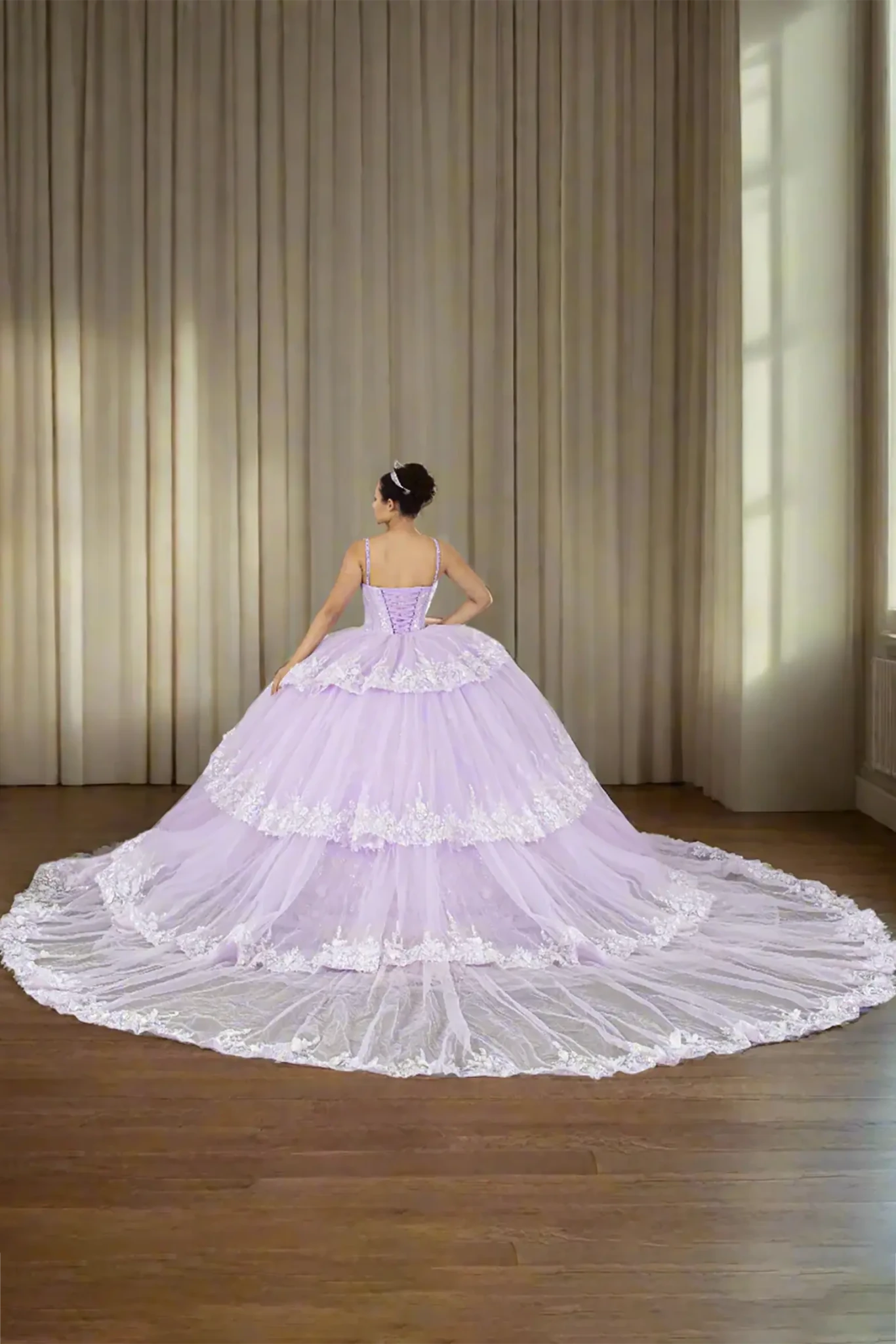 Lilac quinceañera ball gown with crystal beaded bodice, lace trim, layered tulle skirt and detachable train