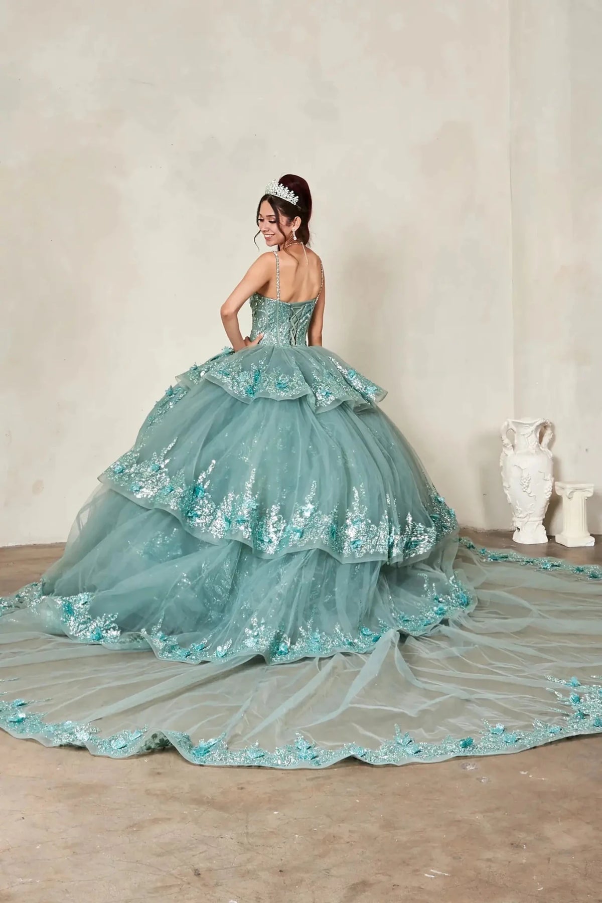 Sage quinceañera ball gown with crystal beaded bodice, floral lace applique and detachable long train