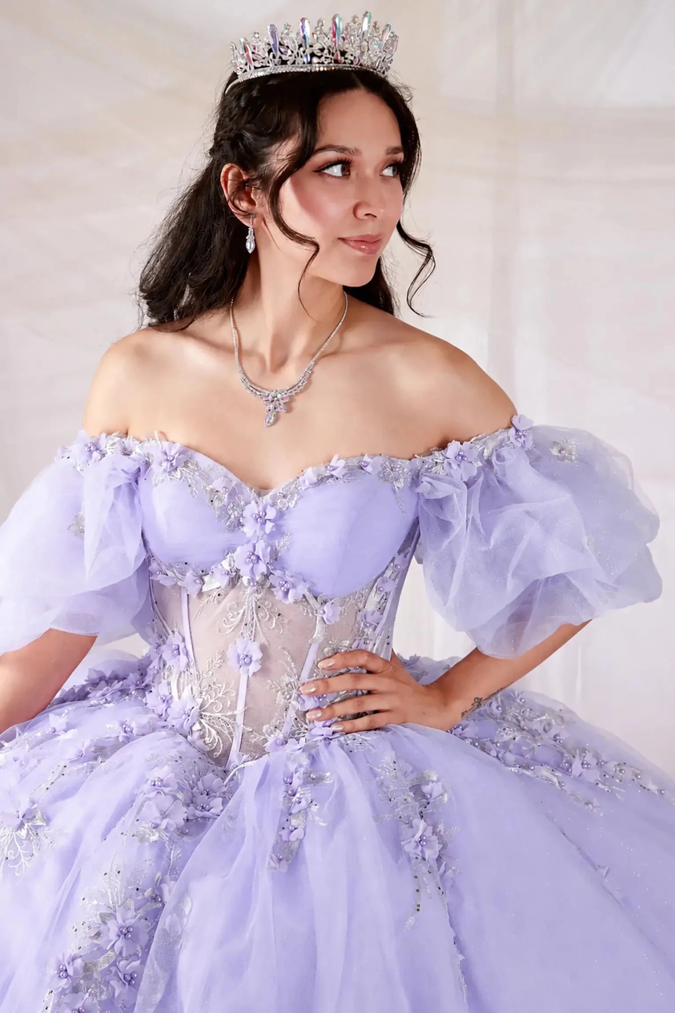 off-the-shoulder lilac quinceañera ball gown with floral lace appliqués and puff sleeves