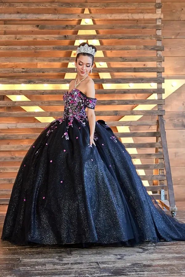 Black quinceañera ball gown with multicolor floral sheer bodice, basque waist and detachable bow