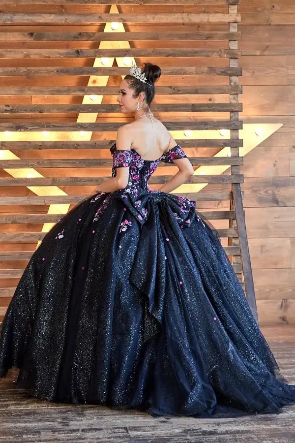 Black quinceañera ball gown with multicolor floral sheer bodice, basque waist and detachable bow