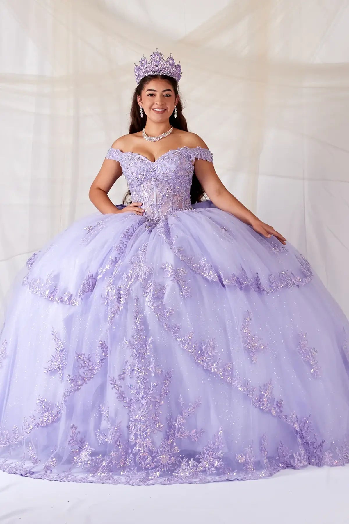 Lilac quinceañera ball gown with sheer sweetheart bodice, floral embroidery and glitter tulle skirt
