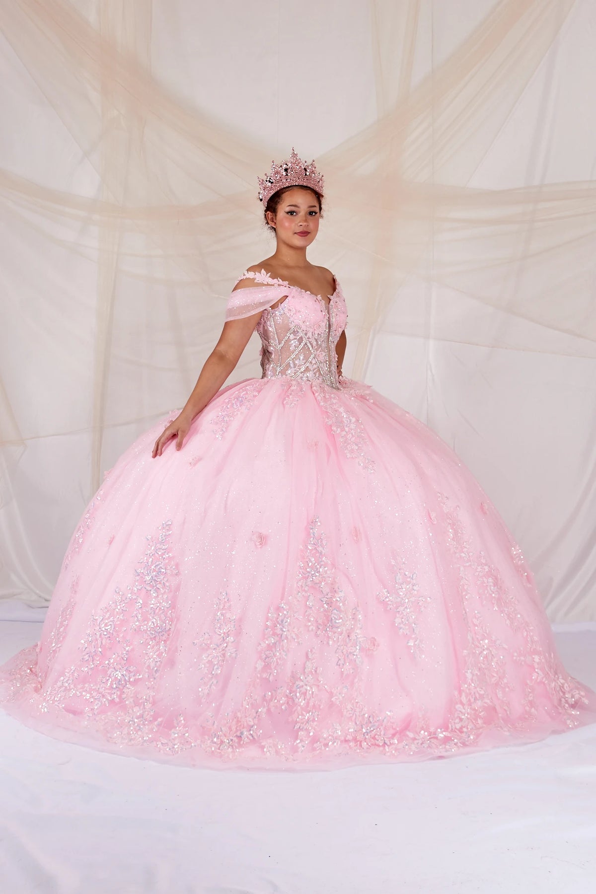 Pink quinceañera ball gown with illusion corset bodice, 3D floral applique and beaded embroidery