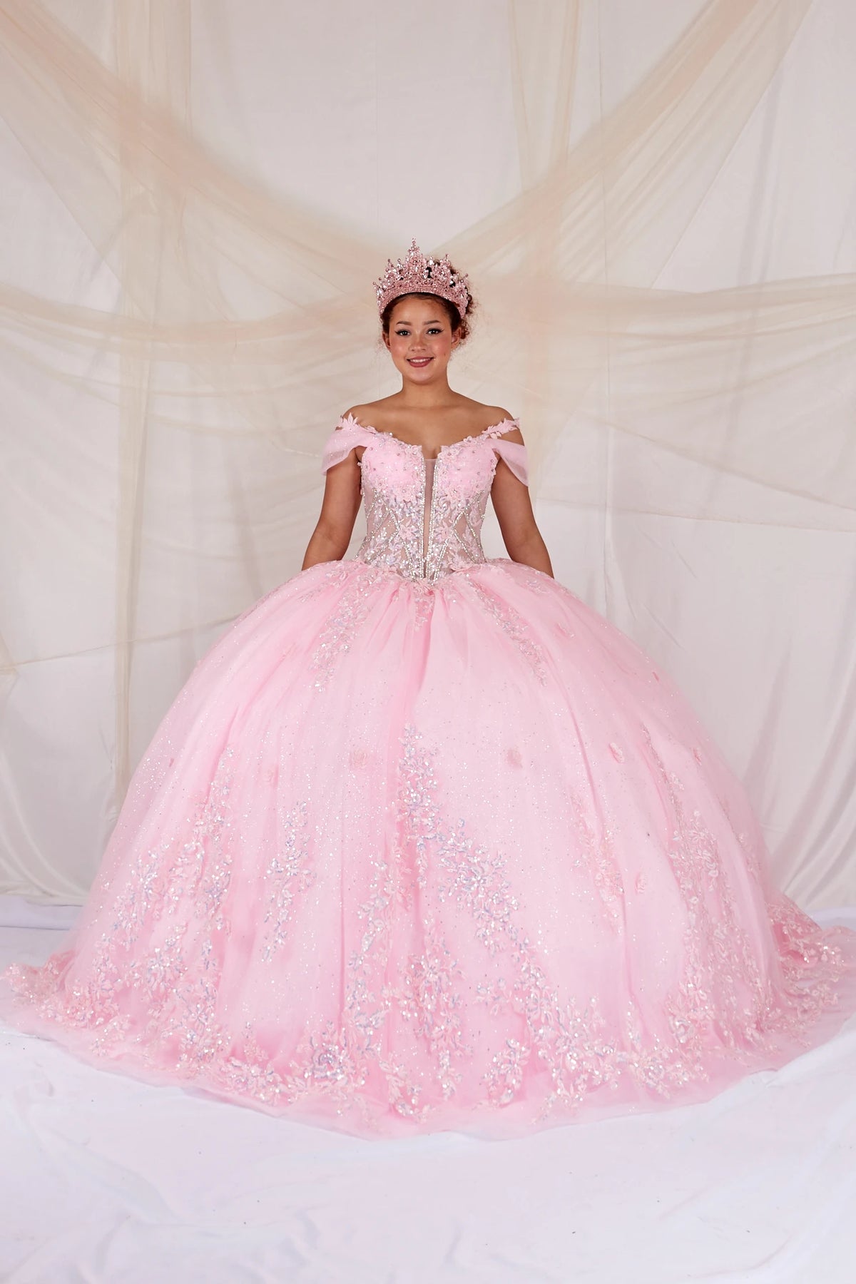 Pink quinceañera ball gown with illusion corset bodice, 3D floral applique and beaded embroidery