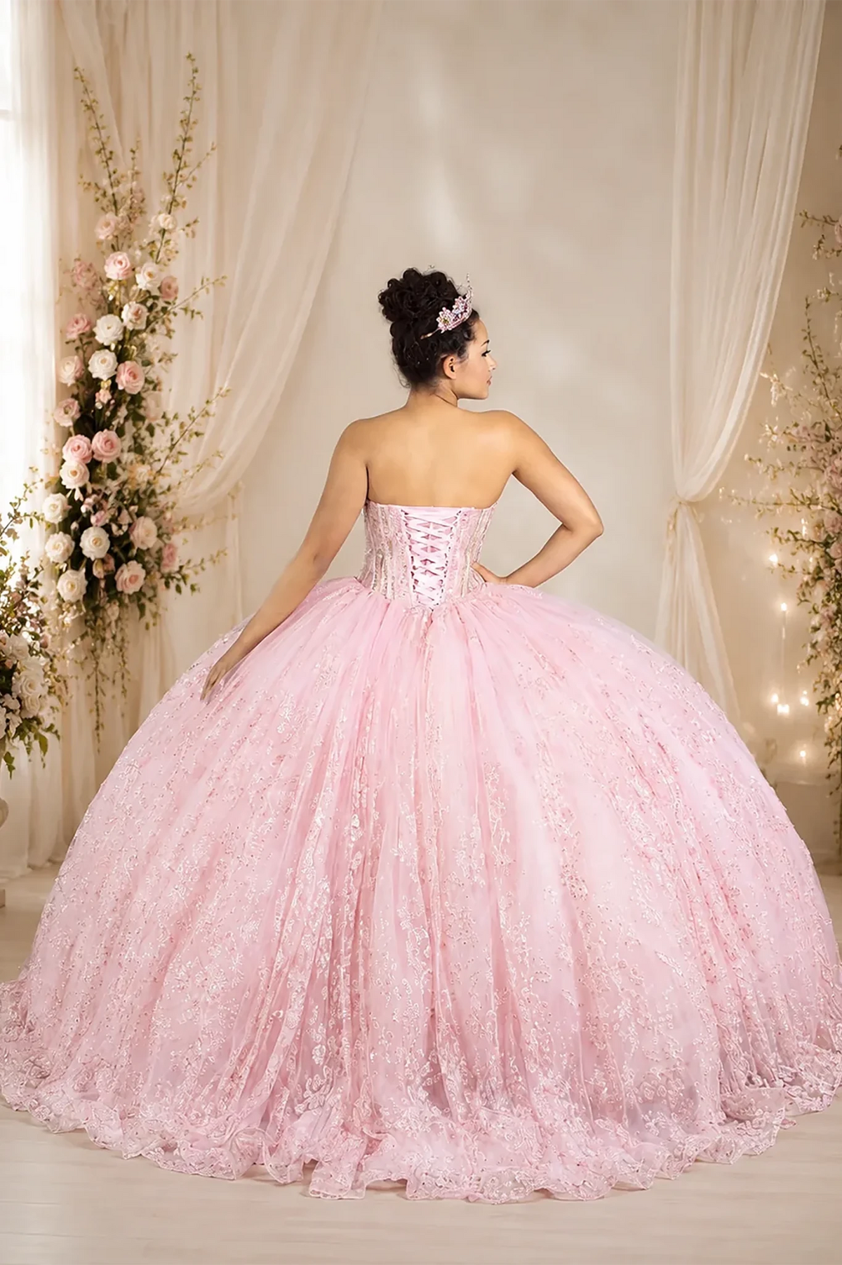 Pink quinceañera ball gown with strapless bodice, lace applique, shimmer beading and glitter tulle skirt