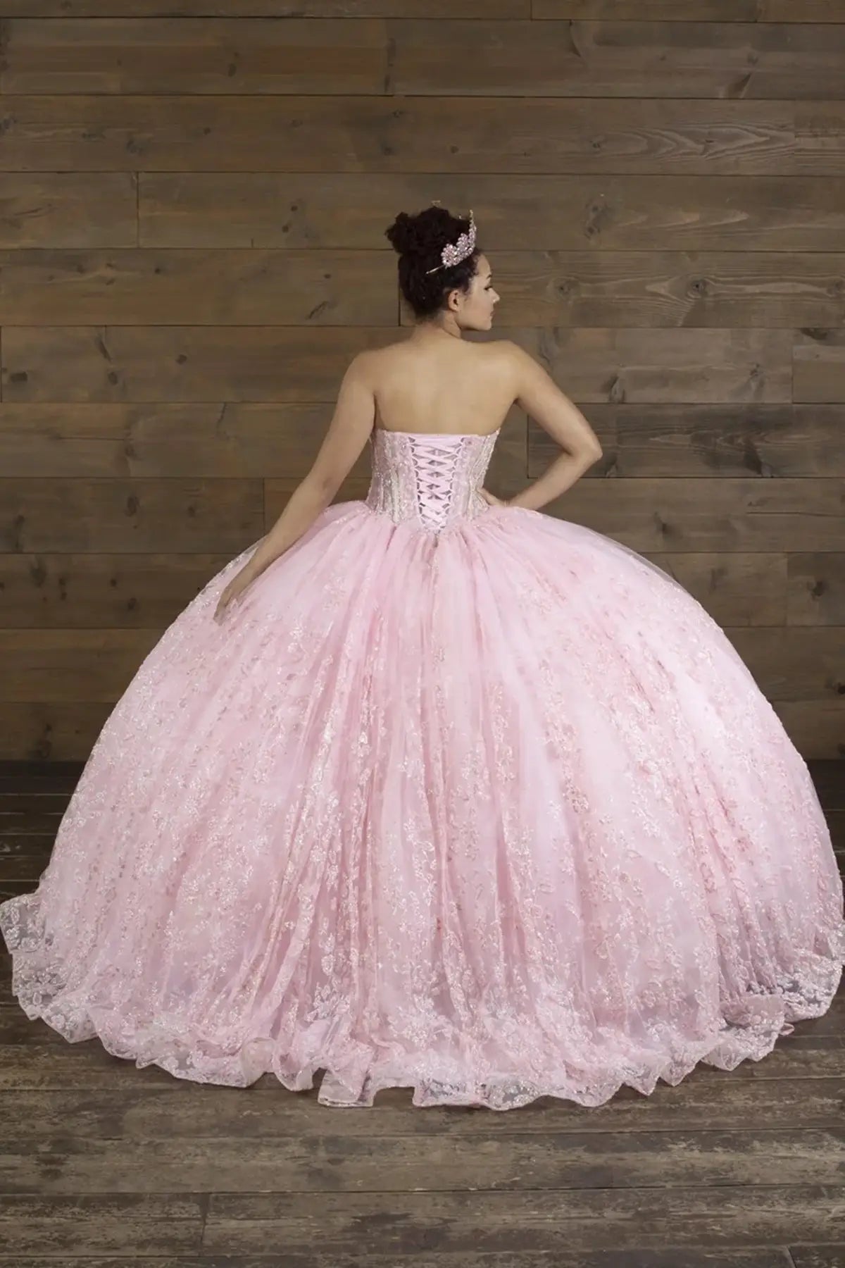 Pink quinceañera ball gown with strapless bodice, lace applique, shimmer beading and glitter tulle skirt