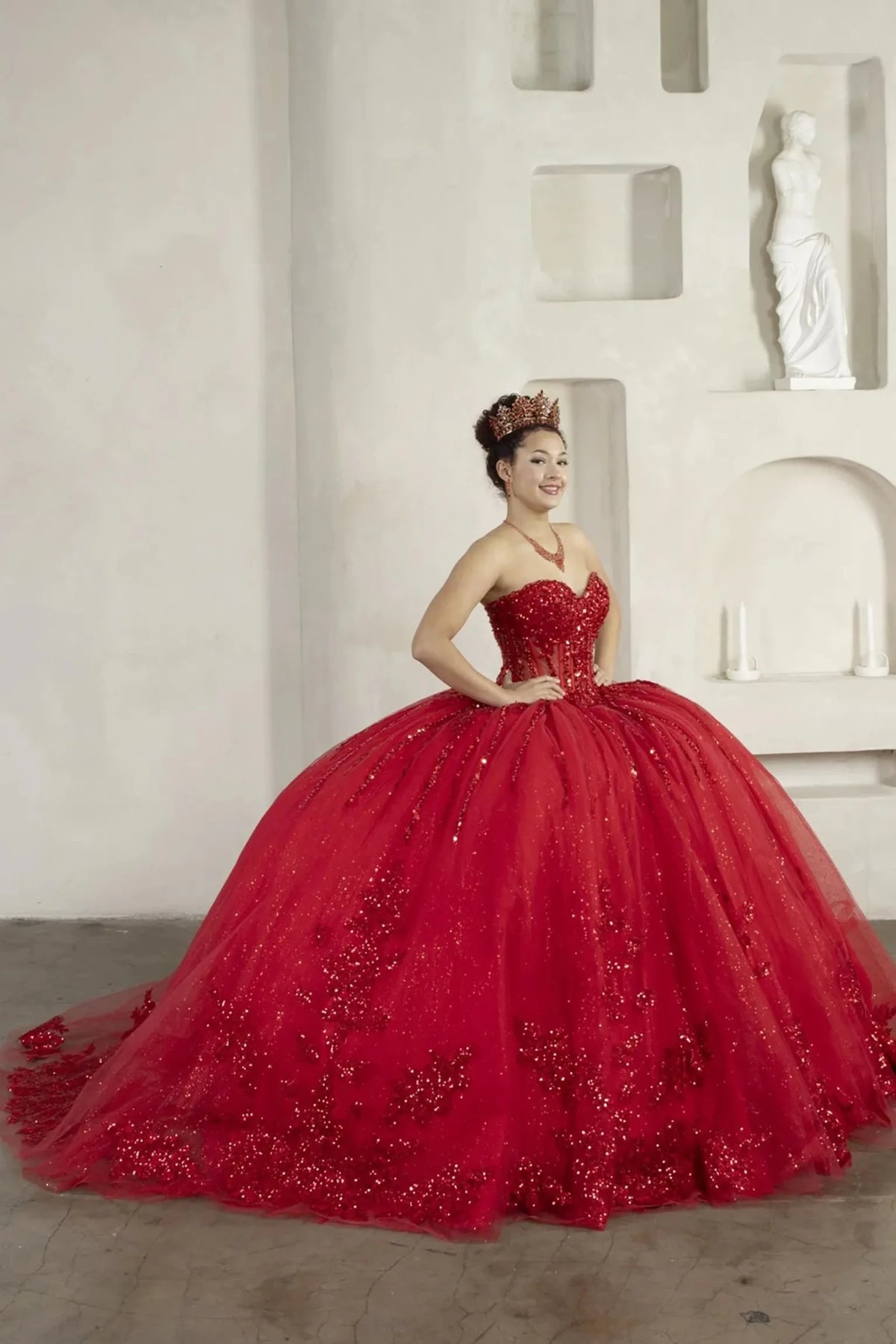 Red quinceañera ball gown with strapless bodice, lace applique, shimmer beading and glitter tulle skirt