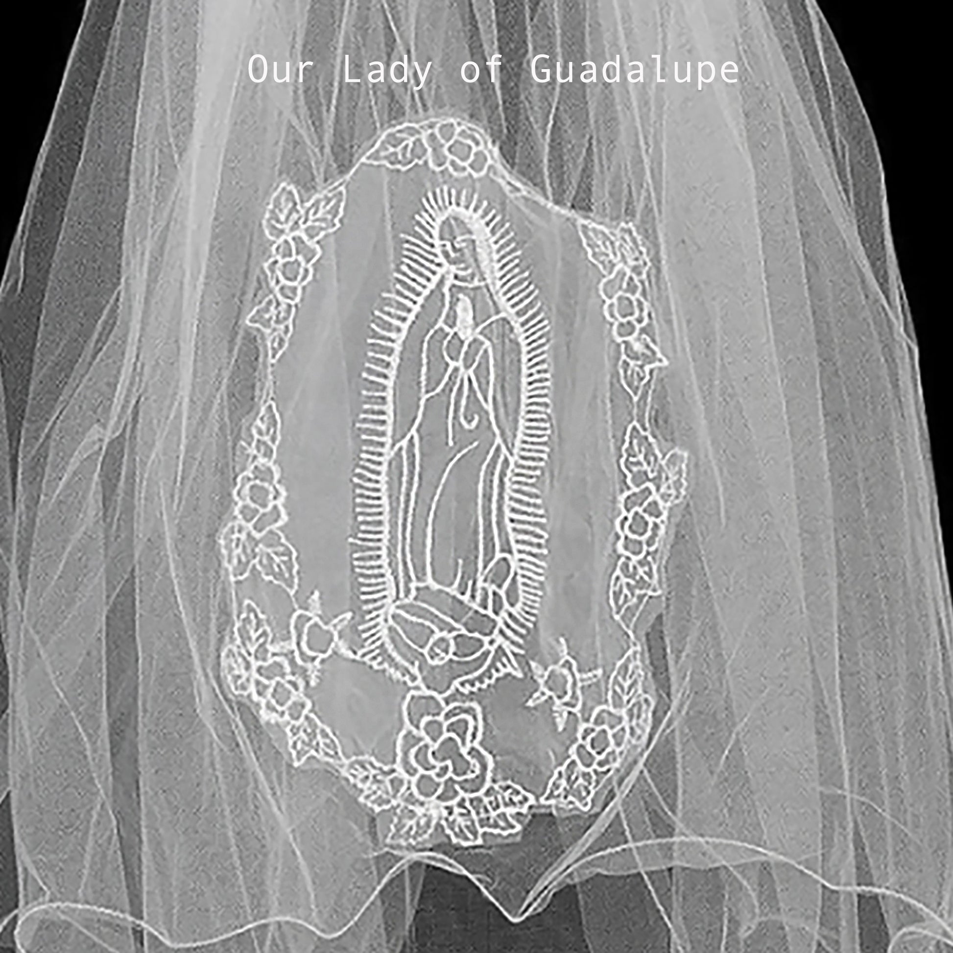 applique with embroidered design of Our Lady of Guadalupe on a plain background