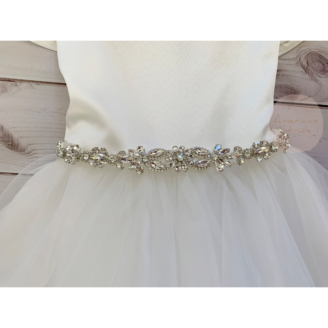 Flower Girl Rhinestone Sash Belt | Crystal Floral Motif Sash - front view of belt on a dress