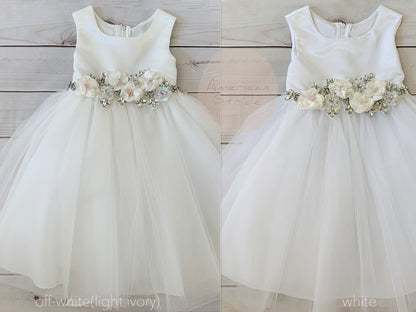 ivory and white dresses on a gray background