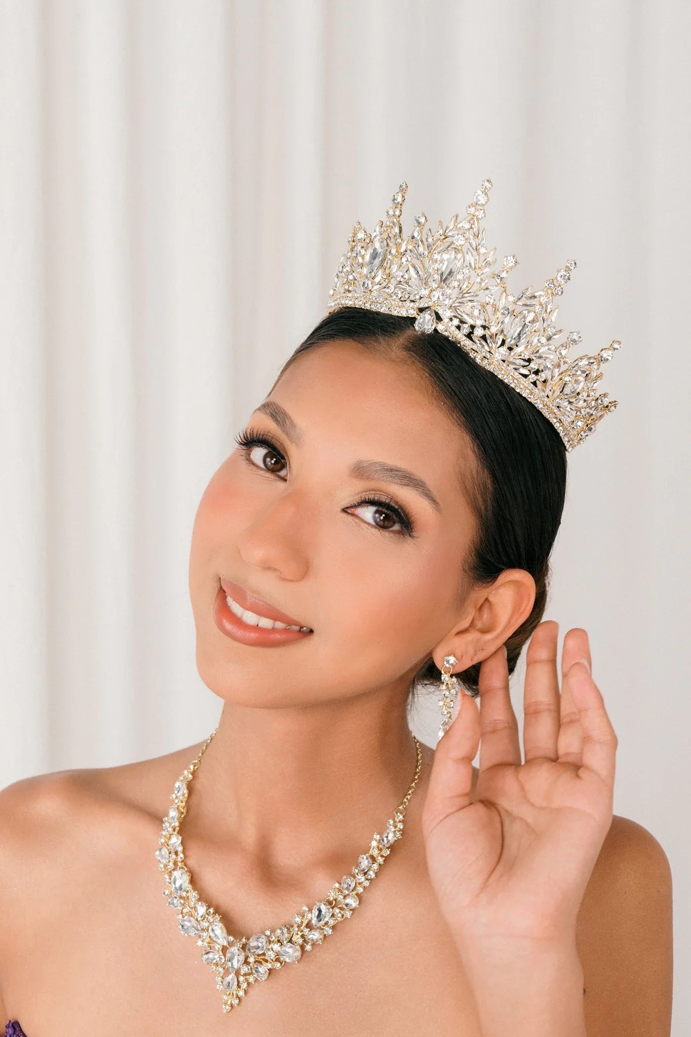 Gold rhinestone quinceañera tiara.