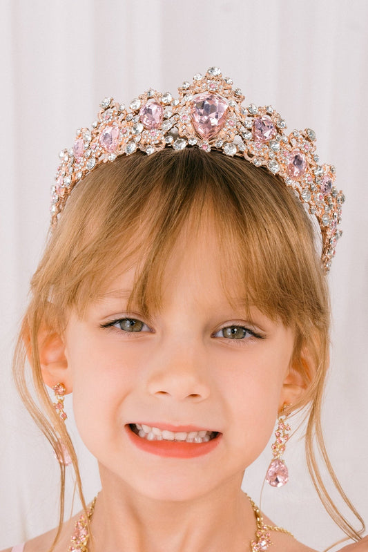 Crystal flowers and rhinestones cover the Rose Gold quinceanera tiara.