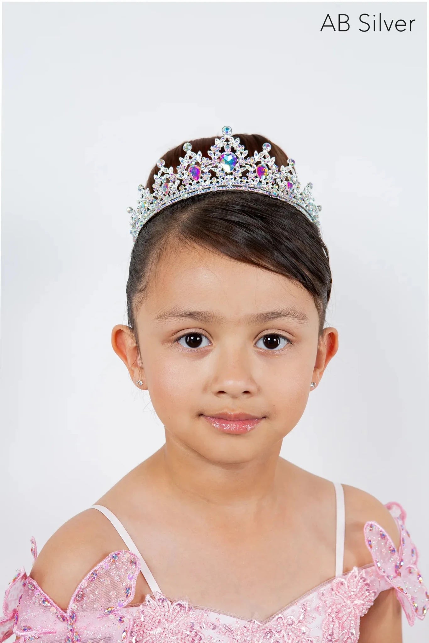 a sparkling silver tiara adorned with pink and blue multi color rhinestones