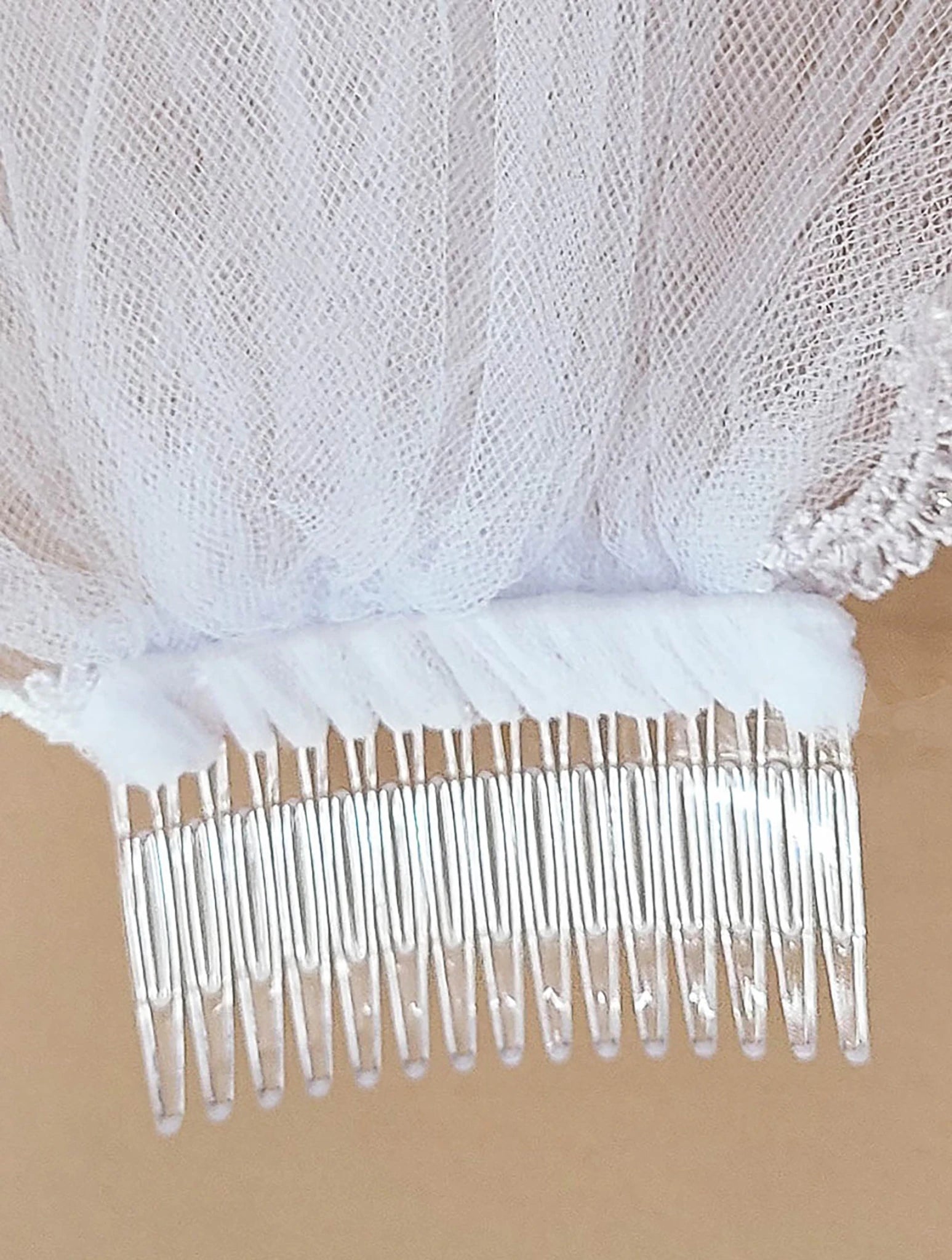 White rhinestone lace floral first communion veil, close-up, comb detail, embellishment detail.