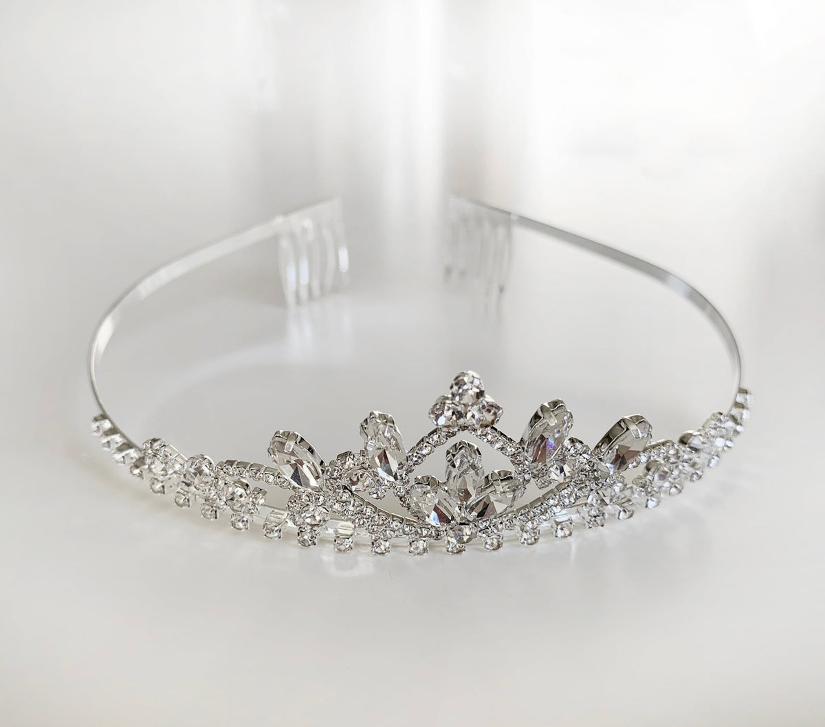 Silver and white rhinestone first communion tiara and two-tier veil.
