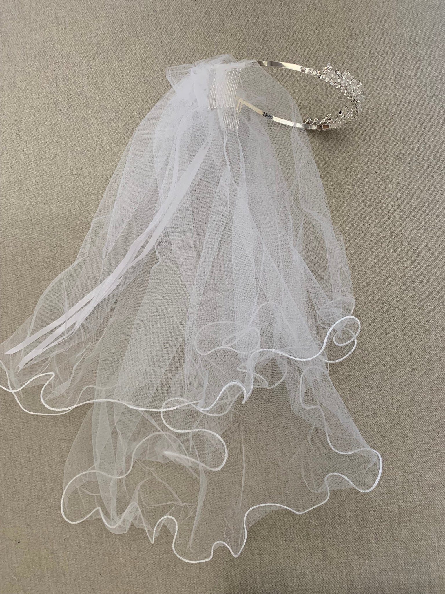 White rhinestone flower girl and first communion tiara and two-tier veil, full view.