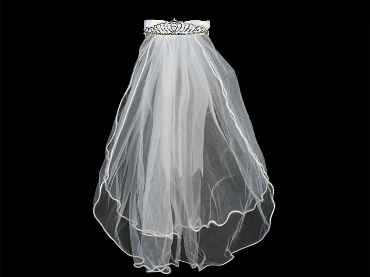 White rhinestone cross first communion tiara and two-tier veil.