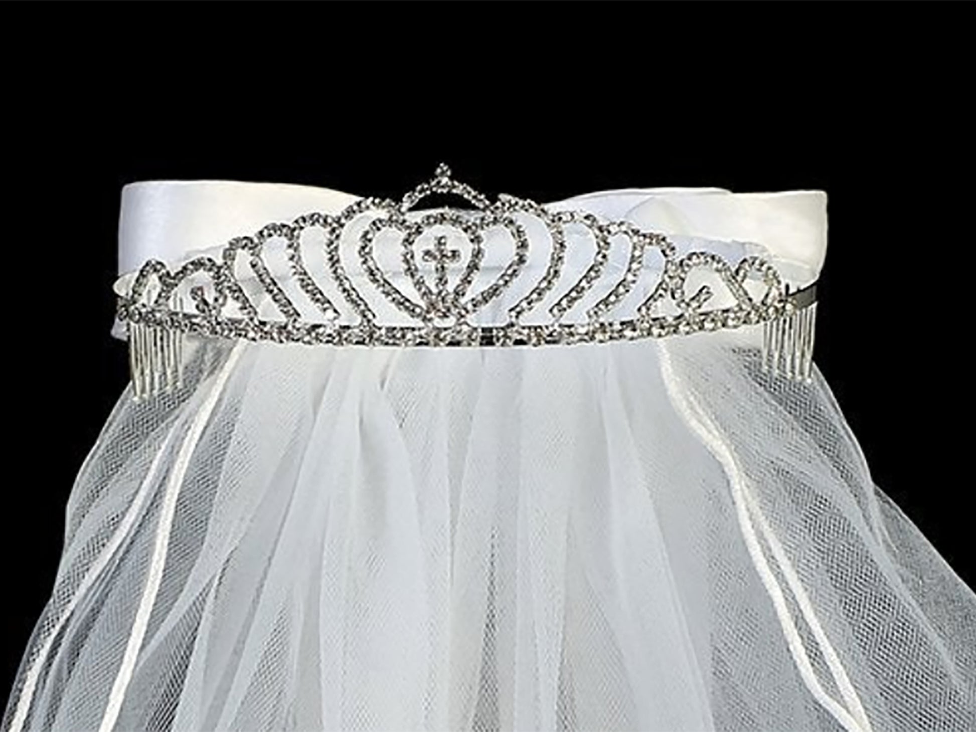 White rhinestone cross first communion tiara and two-tier veil, close-up, embellishment detail.