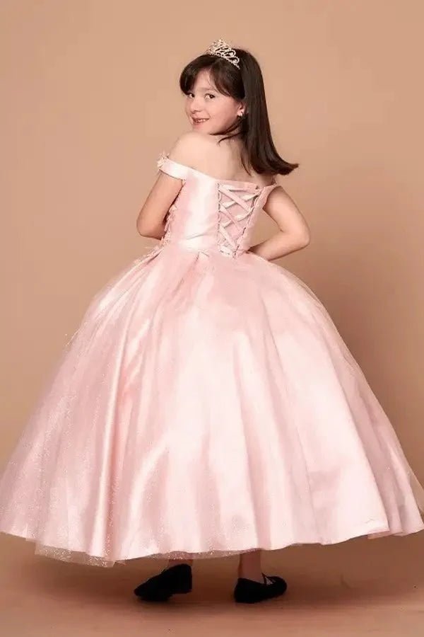 Back view of blush mini quince dress with lace-up closure, 3D floral appliqué accents, glitter tulle, and cascading full skirt.