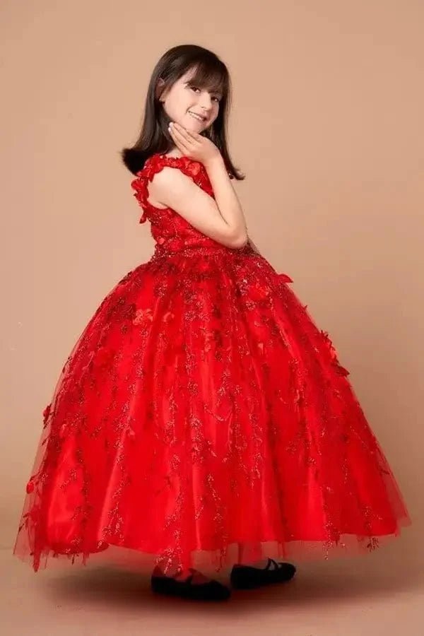 Side view of red mini quince dress with dimensional 3D floral detail, shimmering glitter highlights, and flowing layered tulle skirt.