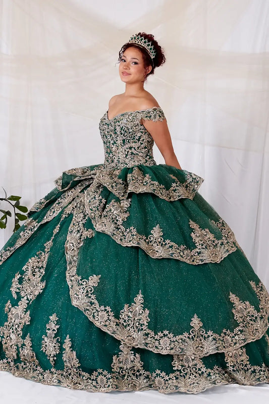 Front-Facing of a woman wearing Emerald green quinceanera gown with off-shoulder sleeves detailed embroidery and layered skirt silhouette