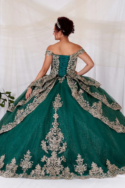 Back-Facing of a woman wearing Emerald formal gown featuring structured back multi-layer skirt and elegant design