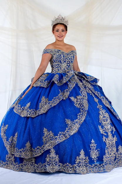 Front-Facing of a woman wearing Royal blue and gold quinceanera gown with off-shoulder sleeves intricate embroidery and layered skirt design