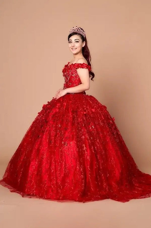 Side View of a woman wearing Bold red gown with floral accents off-shoulder styling and airy skirt design