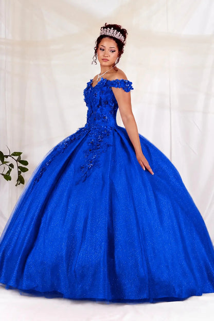 Woman in a blue quinceanera ball gown with intricate 3d floral detailing 