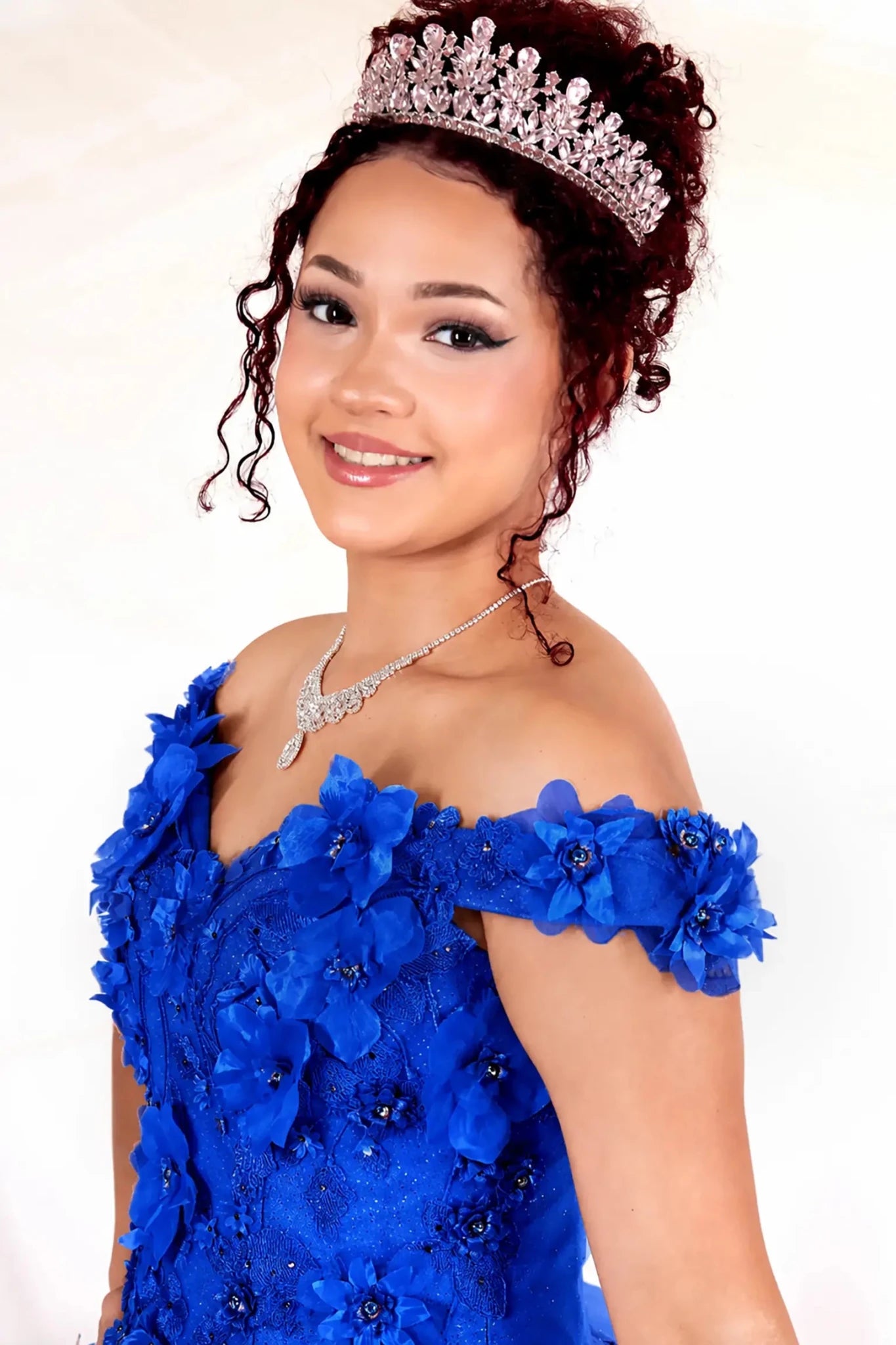 blue quinceanera ball gown with off the shoulder and 3d floral detailing 