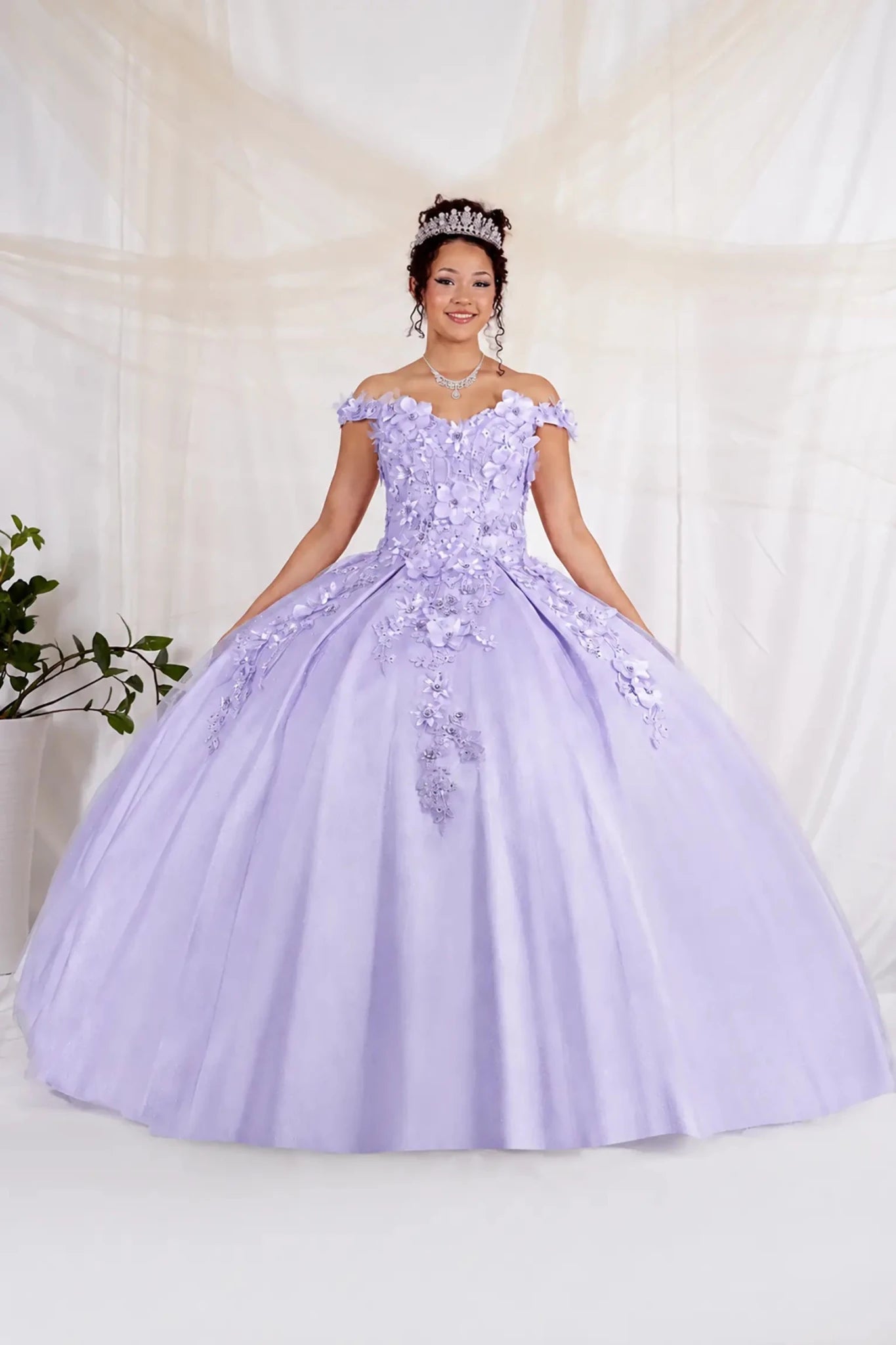 Woman in a lilac quinceanera ball gown with floral details