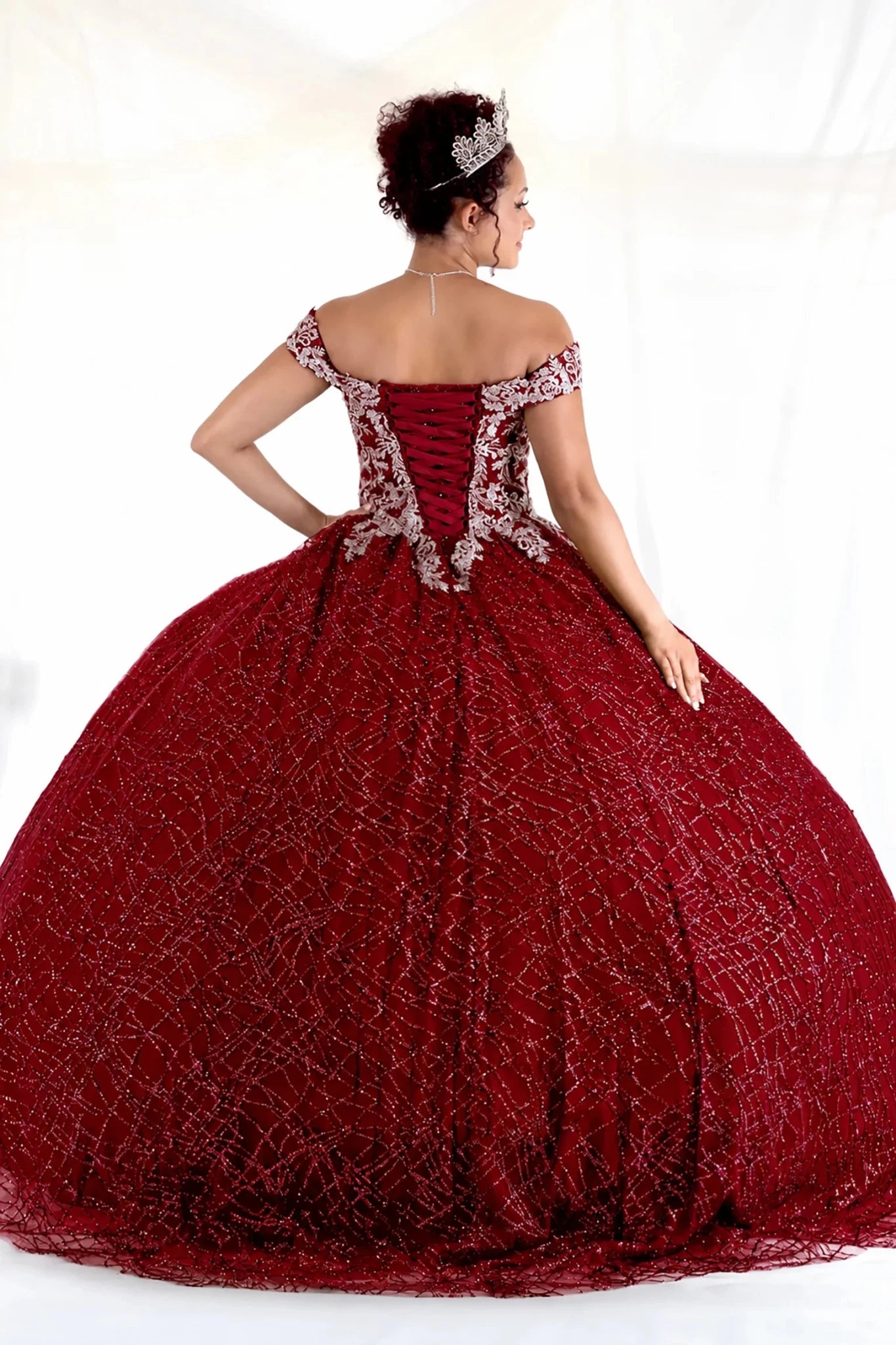 Burgundy quinceañera ball gown with glitter sequins, sparkling bodice and layered tulle skirt