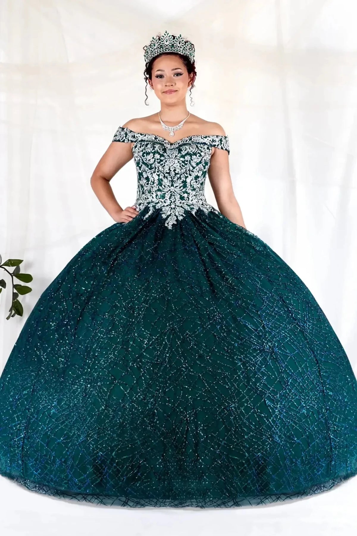 Emerald green quinceañera ball gown with glitter sequins, sparkling bodice and layered tulle skirt